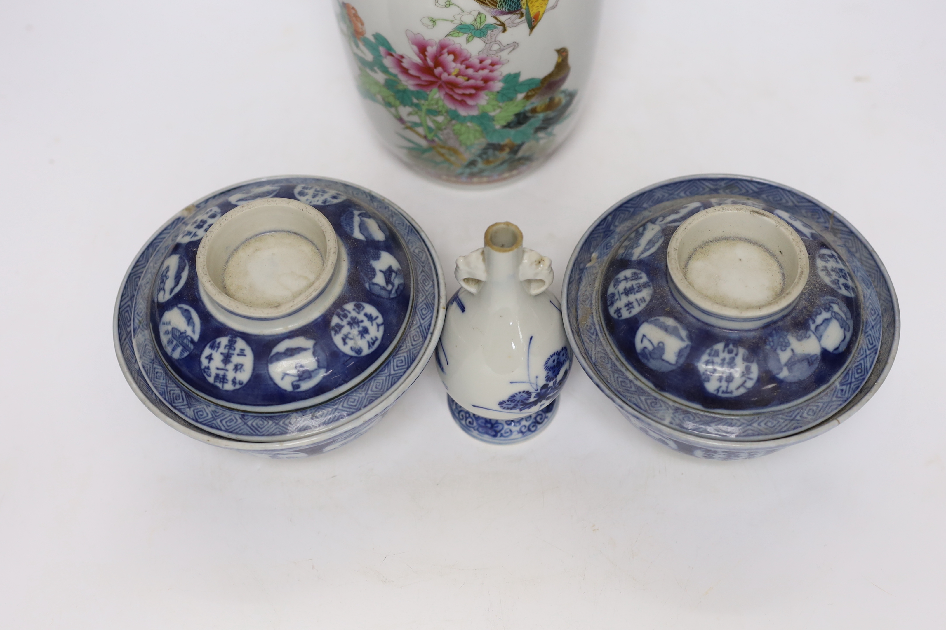 A Chinese famille rose vase, two Japanese blue and white rice bowls and covers and a Japanese blue and white vase (4) tallest 24.5cm